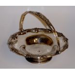 A Victorian Sheffield plate basket with swing handle, foliate cast,