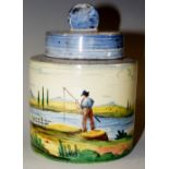 An Italian Faience cylindrical jar and cover the body painted with a river scene with figures and