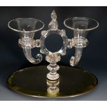 A glass table centrepiece with mirrored base,