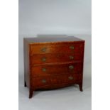 A Regency mahogany chest of four long graduated, cockbeaded drawers,