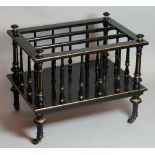 A Victorian black and gilt rectangular three-division canterbury, turned supports with gilt detail,
