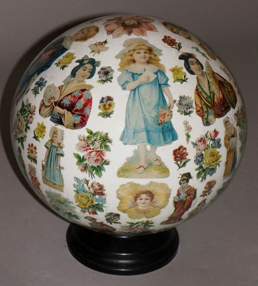 A Victorian Decalomonia decorated ball, 28cm diameter,