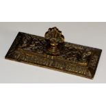 A brass  paper weight bearing 'W&R Leggott Ltd London, Locks, Manchester & Bradford,