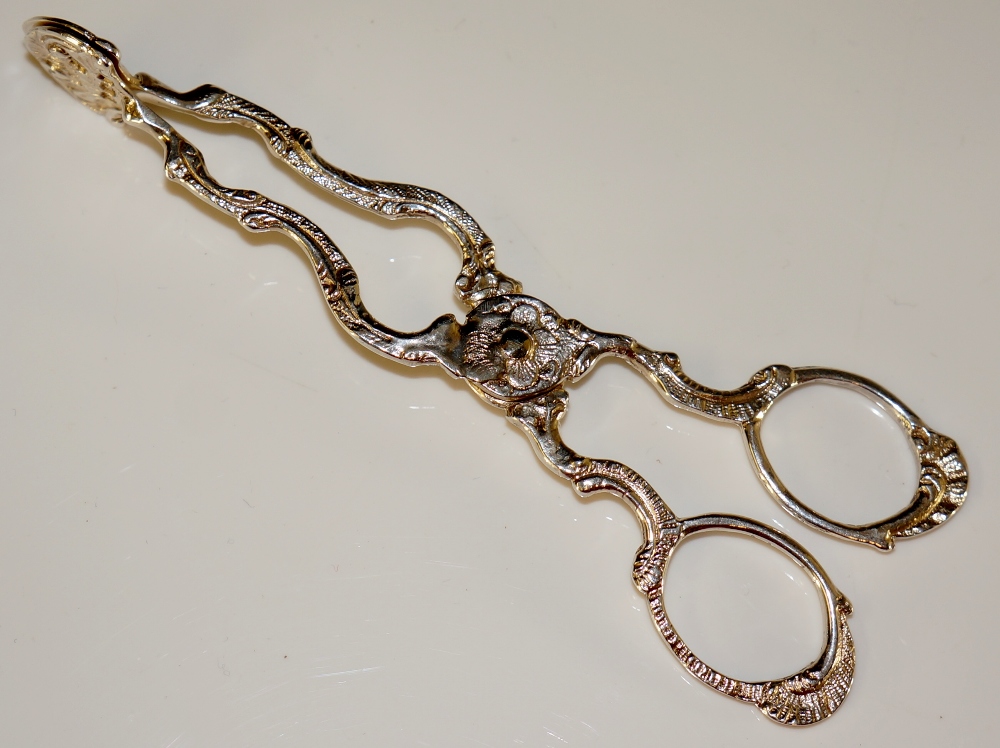 A pair of Victorian scissor action sugar nips in George III style with cast handles, 12cm long, - Image 2 of 2