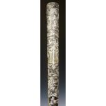 An Indian silver cased walking stick the tapered shaft chased with animals and trees,