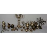 A quantity of silver plated teapots, jugs, candlesticks, etc.