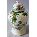 A Chinese baluster vase and cover the body painted with cranes amidst  chrysanthemum blossom and