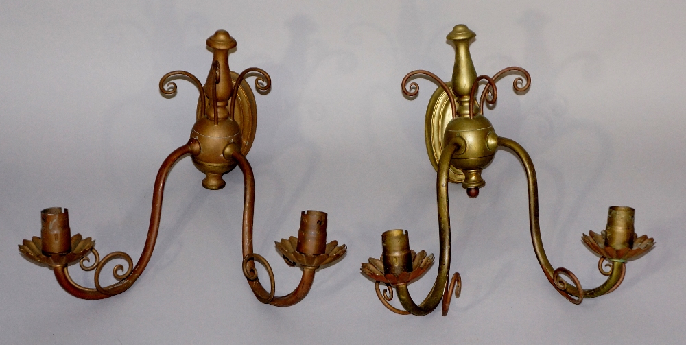 A pair of brass two branch wall lights in the style of WAS Benson with oval back plates,