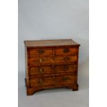 A compact walnut veneered chest of drawers in George I style,