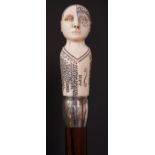 An ivory Phrenology head walking stick with foliate engraved silver barrel shaped collar,