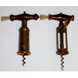 A helix corkscrew with brass barrel, reeded and bearing patent device, turned wood handle and brush,