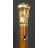 A Georgian Malacca walking stick with foliate engraved gold coloured metal top and eyelets,