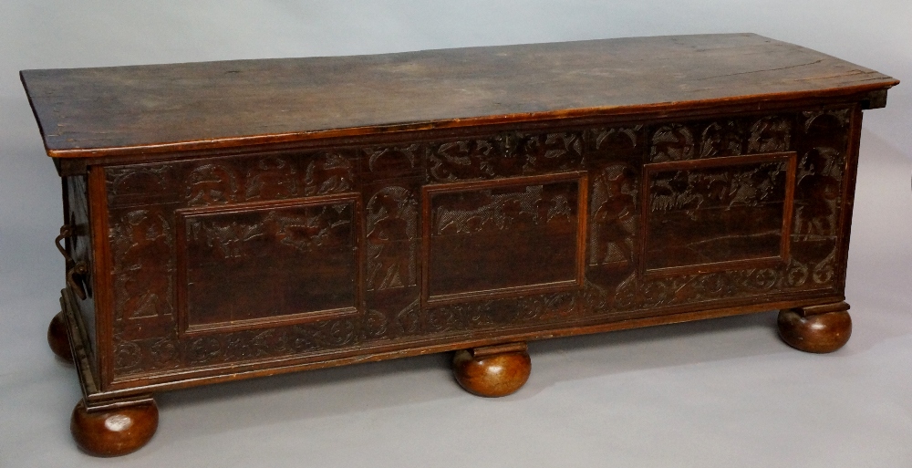 A 17th Century Italian cedar chest the plank top internally decorated in poker work with panels of