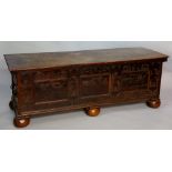 A 17th Century Italian cedar chest the plank top internally decorated in poker work with panels of
