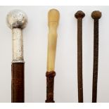 A collection of four 19th Century riding crops,