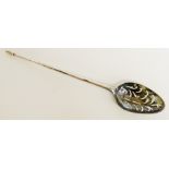 A George III Mote spoon with pierced bowl the plain stem with chamfered tapered finial,