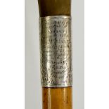 A walking stick with horn handle and foliate engraved silver collar inscribed "Presented By The