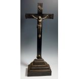 A 19th Century pressed silver Corpus of conventional form the ebonised oak cross with INRI banner