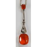 A fire opal necklace the fine link necklet with one small and one large claw set fire opal on a