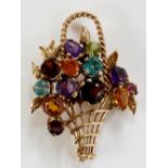 A gem set gold basket brooch, claw set with coloured stones, rope twist handle, 4.