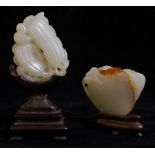 A pale celadon jadeite leaf carving with two fruit, 5cm long,