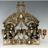 A nine branch Menorah the pierced back with stylised birds and scrolls applied turquoise,