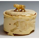 A good Japanese ivory tusk box and cover the body finely relief carved and decorated with two