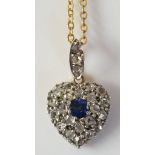 A diamond set heart shaped pendant with central sapphire brilliant,