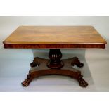 A William IV mahogany dining table with figured butterfly veneered rounded rectangular top,