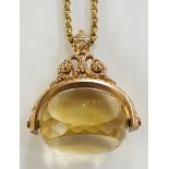 A 9ct gold fob seal of unusually large proportions with faceted swivel topaz,