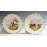 A pair of Royal Crown Derby hunting scene shaped circular plates by C. M.