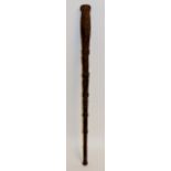 An Australian sailor's staff or club, the tapered hardwood shaft carved with rope,