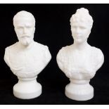 A pair of French opaque white glass moulded busts of Le Tsar Nicholas and La Tsarina,