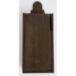 An oak hanging tinder box of rectangular outline with shaped back, 27cm high,