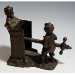 A late 19th Century bronze figural press,