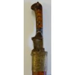 An Afghan khyber knife with tapered blade and horn handle, the scabbard with engraved brass mounts,