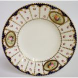 A Royal Crown Derby cabinet plate the border panelled with rose sprays and three ovals finely