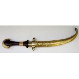 A Persian brass cased dagger the wooden handle with axe head terminal and brass collars,