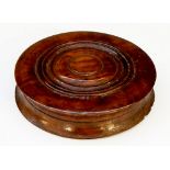 A 19th Century turned wooden box, the lid with ring detailing,
