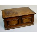 A late 17th Century Spanish walnut box the hinged lid revealing interior with candle box with