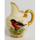 A Royal Worcester miniature jug the ivory body painted with a bird amidst leafage,