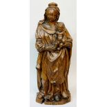 An early 17th Century trunk carving of the Virgin Mary and Child, 100cm high,