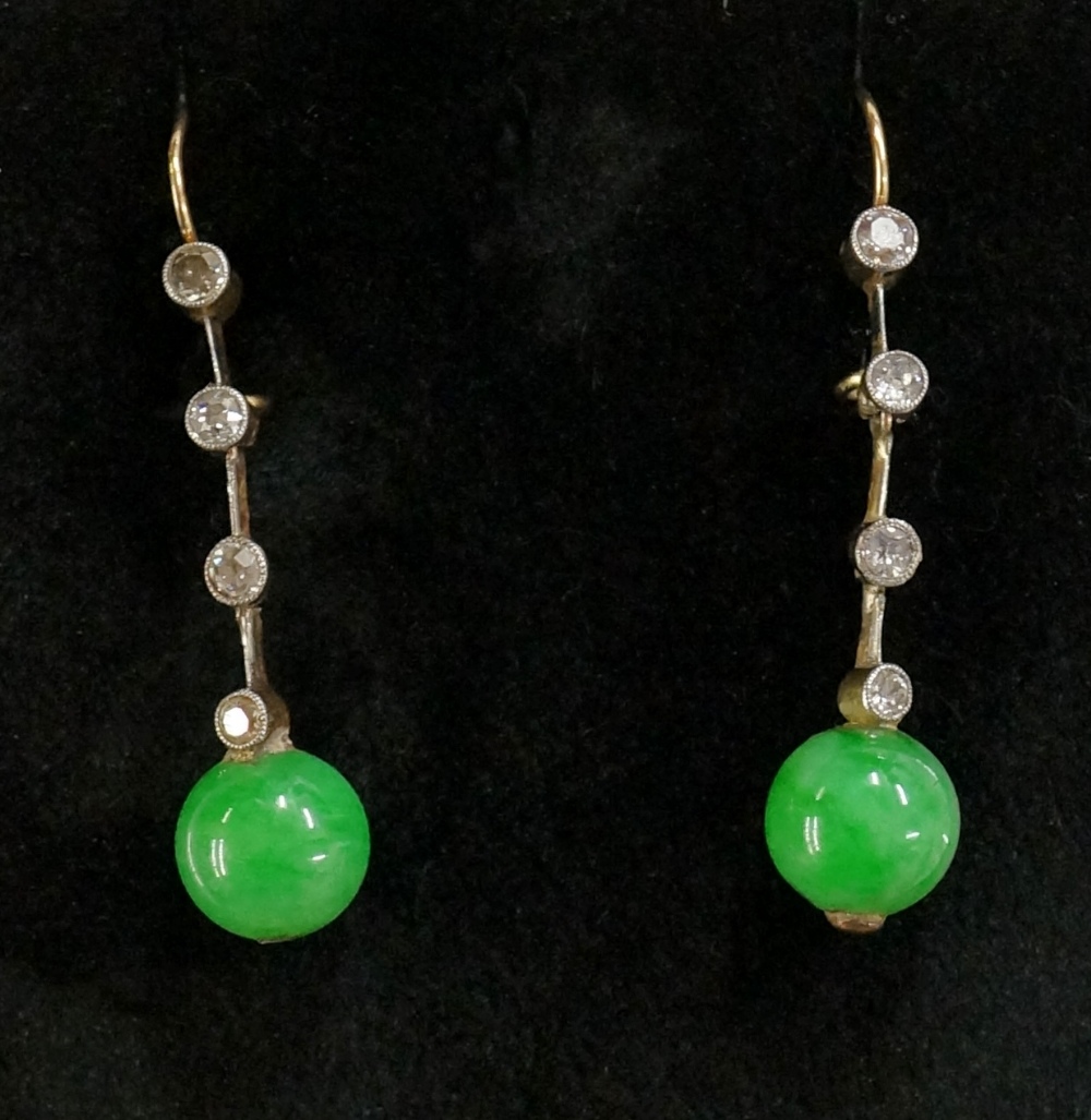 A pair of jadeite and diamond earrings the jadeite spheres beneath a bar set four circular diamond