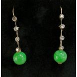 A pair of jadeite and diamond earrings the jadeite spheres beneath a bar set four circular diamond