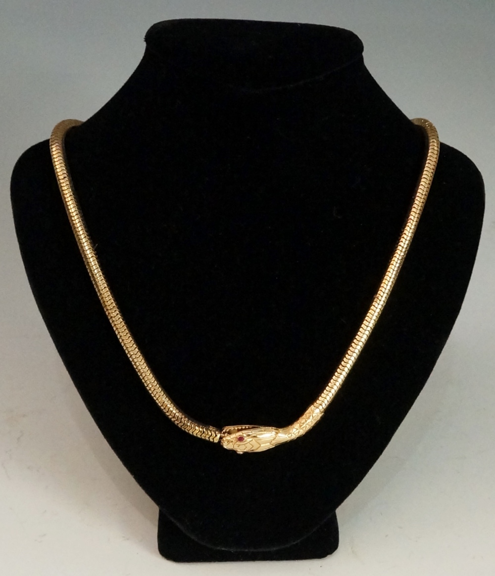 A French gold snake necklace of articulated design with engraved neck the head with garnet eyes and - Image 2 of 2