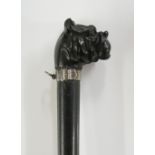 A 19th Century folding silk parasol, the ebony handle and shaft,