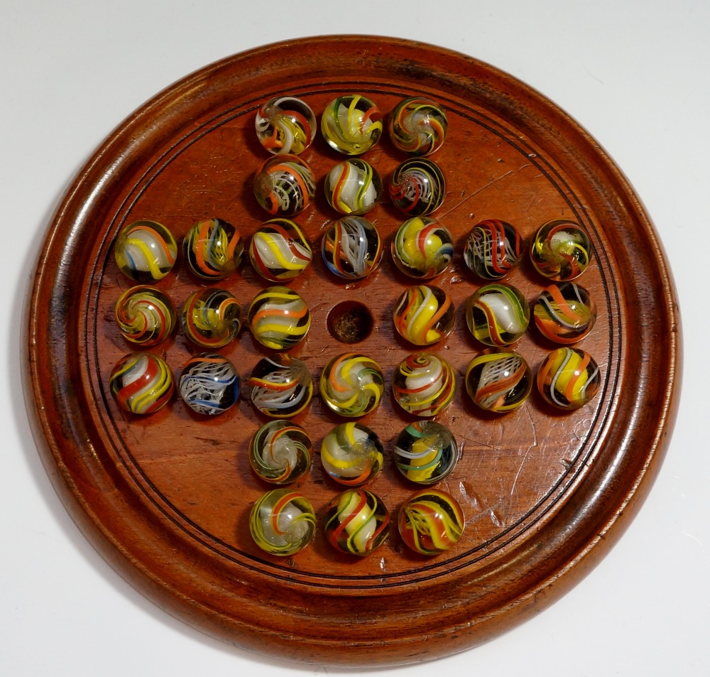 A Victorian walnut solitaire base with a set of 32 contemporary marbles,