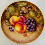 A Royal Worcester circular pedestal bowl still painted to the interior with peaches,