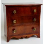 An early 19th Century miniature mahogany chest of drawers,