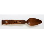 A late 18th / early 19th Century Welsh fruitwood love spoon with heart pierced terminal the stem